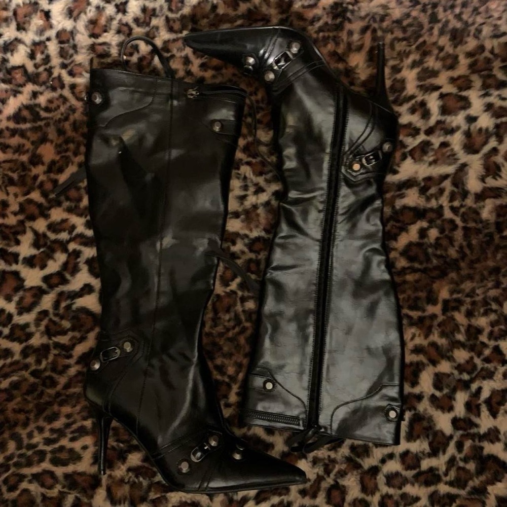 Metal studded knee high boots.